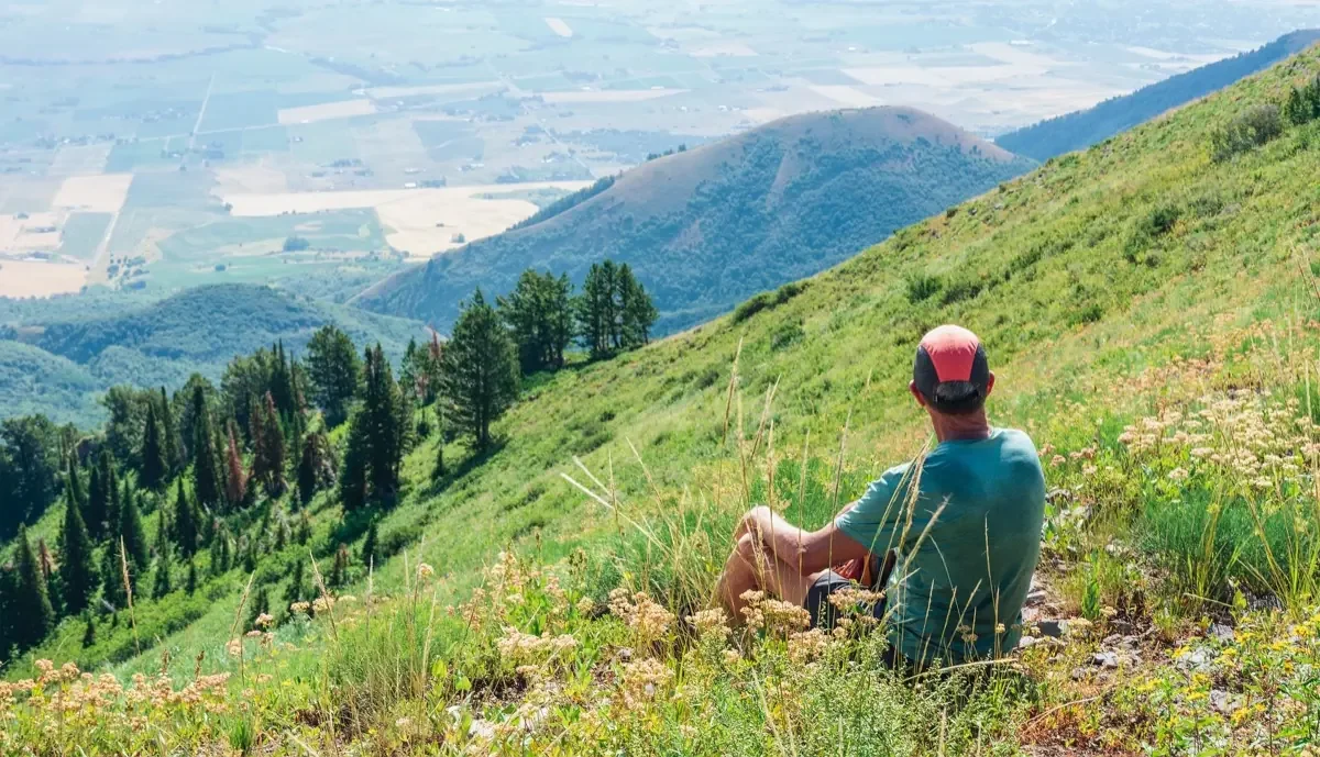 Hiker wildflower slope