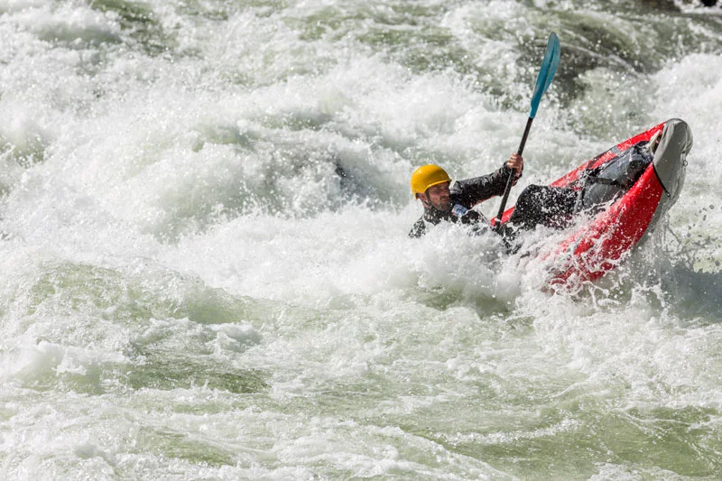 Kayaker in rapid