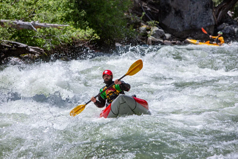 Kayaker wild eye in rapid